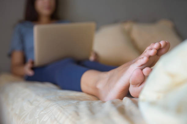 istock Mature businesswoman working from bed 1274757877