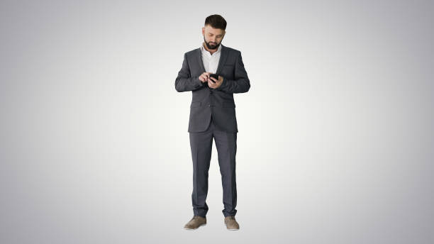 istock Turk business man texting on his phone on gradient background 1274758449