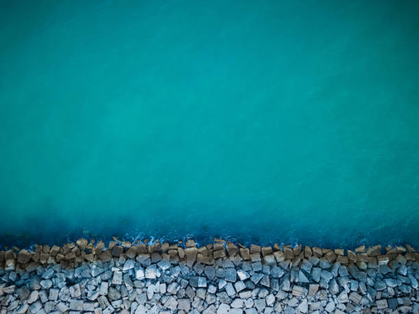 Aerial view of cement cube blocks protecting the shore from the waves