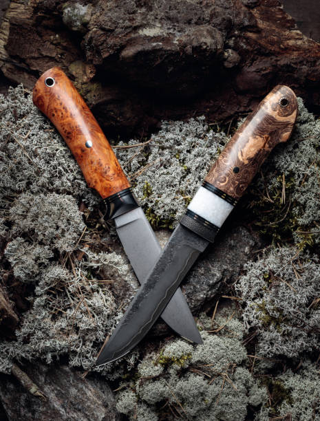istock Hunter combat hand made knife on a moss in forest. 1274787697