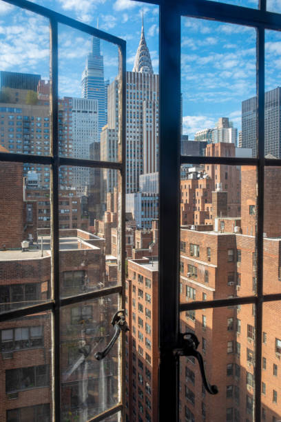 Manhattan skyline through open vintage window
