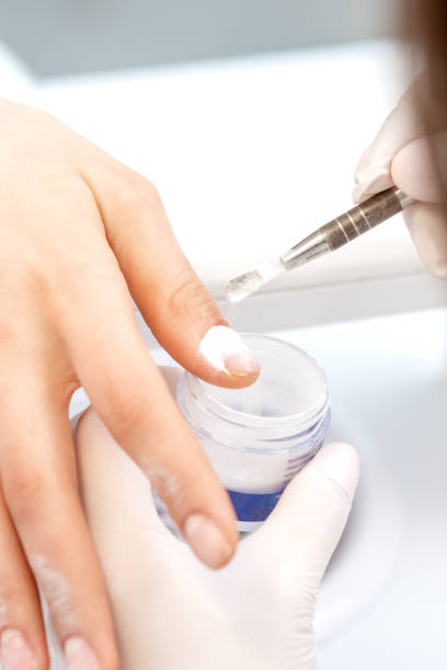 istock Process of applying acrylic powder on the nails 1274805652