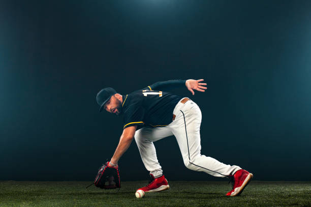 istock Baseball player on dark background. Ballplayer portrait. 1274818803