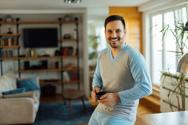 istock Handsome smiling man in pajamas, portrait. 1274828949