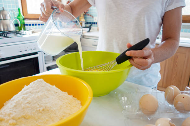 istock Woman preparing pancake batter 1274834979