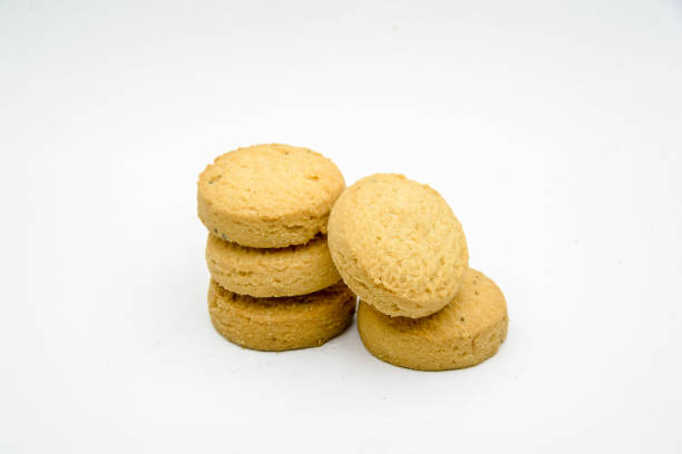 istock biscuits isolated on dark background.Atta biscuit, cookies, white flour biscuit - Indian cooking 1274845821