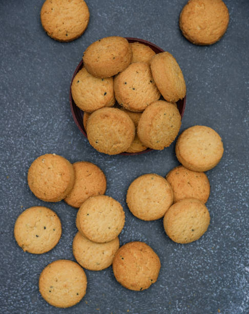 istock biscuits isolated on dark background.Atta biscuit, cookies, white flour biscuit - Indian cooking 1274846100