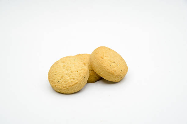 istock biscuits isolated on dark background.Atta biscuit, cookies, white flour biscuit - Indian cooking 1274846102