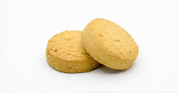 istock biscuits isolated on dark background.Atta biscuit, cookies, white flour biscuit - Indian cooking 1274848003