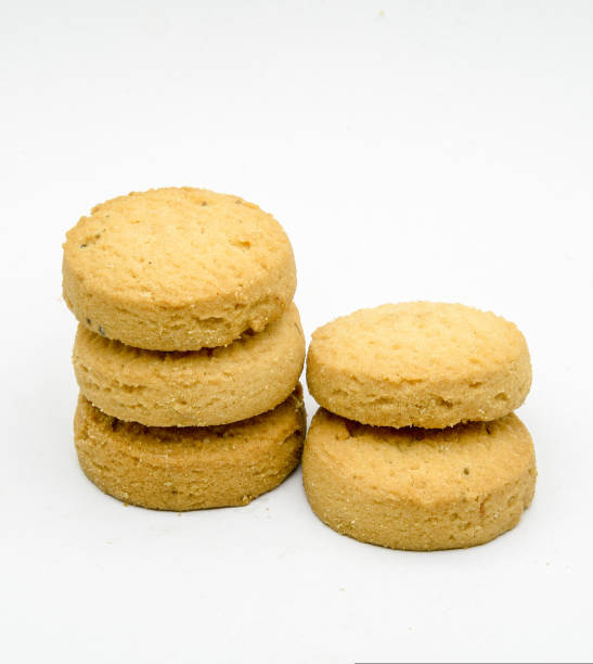 istock biscuits isolated on dark background.Atta biscuit, cookies, white flour biscuit - Indian cooking 1274848408