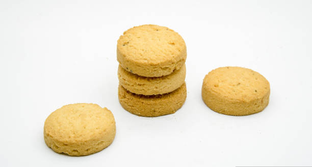 istock biscuits isolated on dark background.Atta biscuit, cookies, white flour biscuit - Indian cooking 1274848489