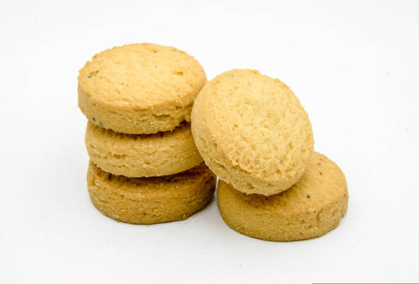 istock biscuits isolated on dark background.Atta biscuit, cookies, white flour biscuit - Indian cooking 1274848763