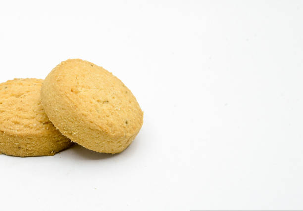istock biscuits isolated on dark background.Atta biscuit, cookies, white flour biscuit - Indian cooking 1274849009