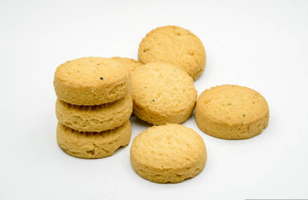 istock biscuits isolated on dark background.Atta biscuit, cookies, white flour biscuit - Indian cooking 1274849068