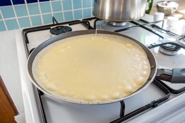 istock Woman Preparing Crepes 1274855209