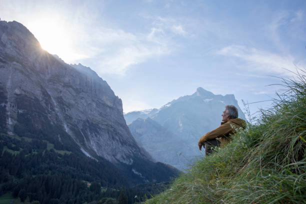 istock Hiker relaxes in alpine meadow, at sunrise 1274857073