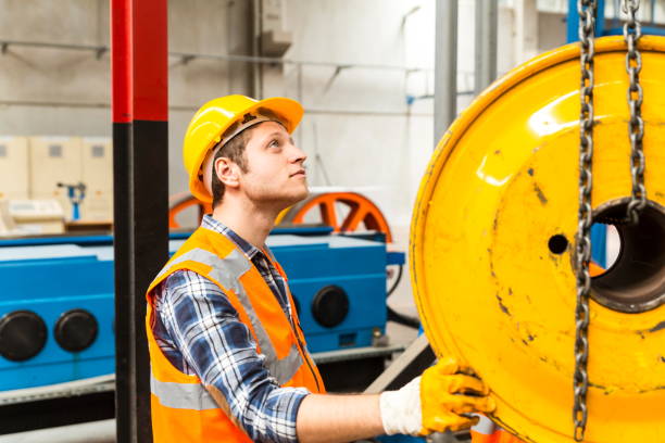 istock Young businessman holding and working with remote control for operating crane 1274867153