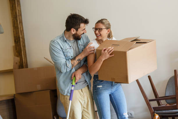 istock Young married couple moving into new home. 1274869061