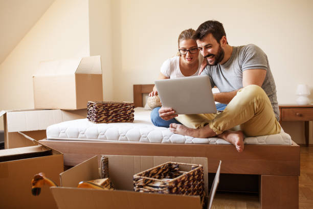 Young couple moving into new home.