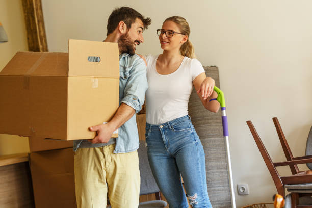istock Young married couple moving into new home. 1274869123