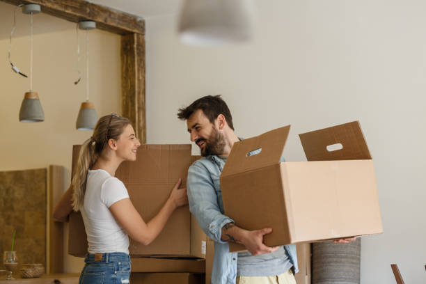 istock Young married couple moving into new home. 1274869128