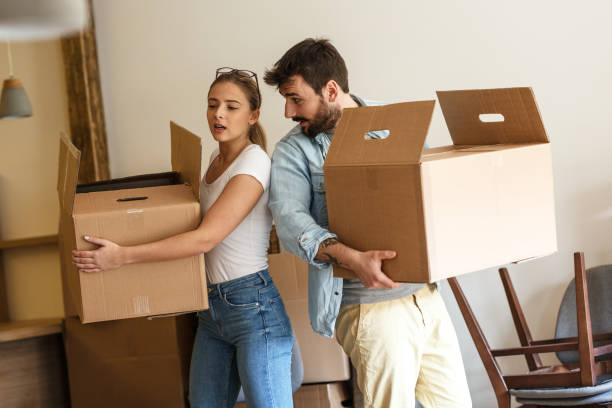 istock Young married couple moving into new home. 1274869133