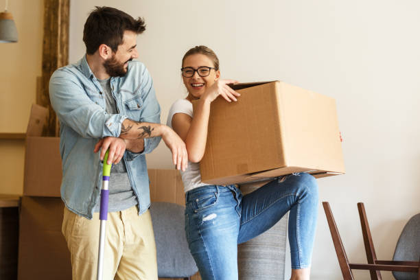 istock Young married couple moving into new home. 1274869151
