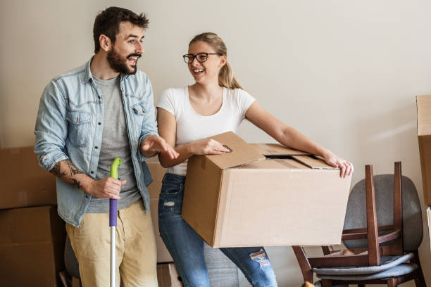 istock Young married couple moving into new home. 1274869157