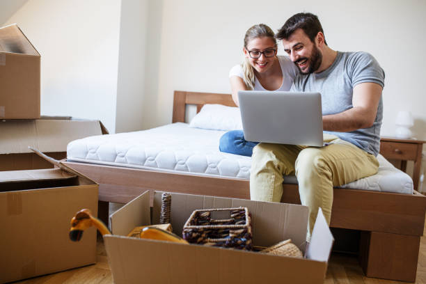 istock Young couple moving into new home. 1274869222