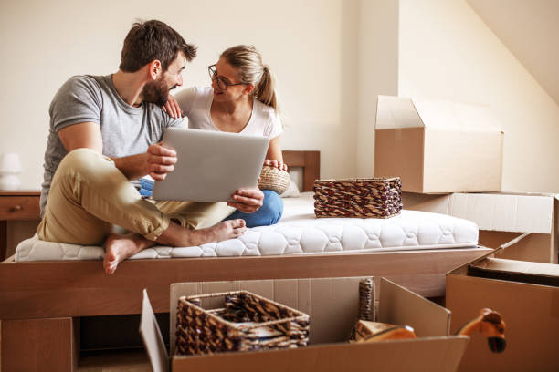 istock Young couple moving into new home. 1274869235