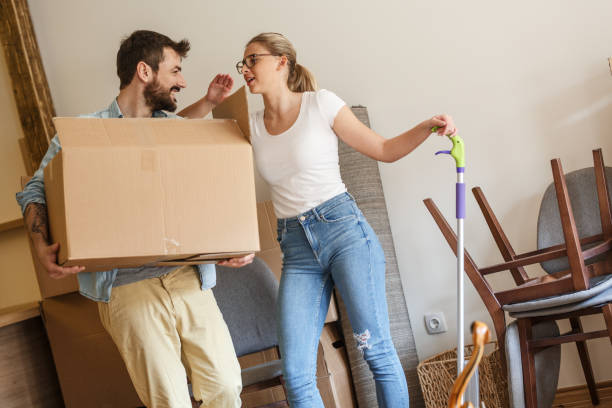 istock Young married couple moving into new home. 1274869278