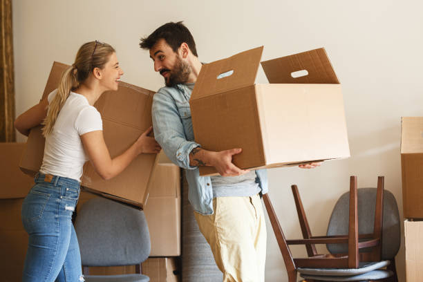 istock Young married couple moving into new home. 1274869335
