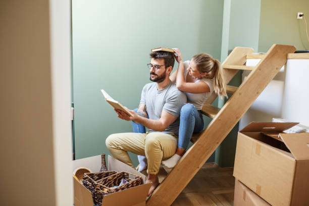 istock Young couple moving into new home. 1274869594