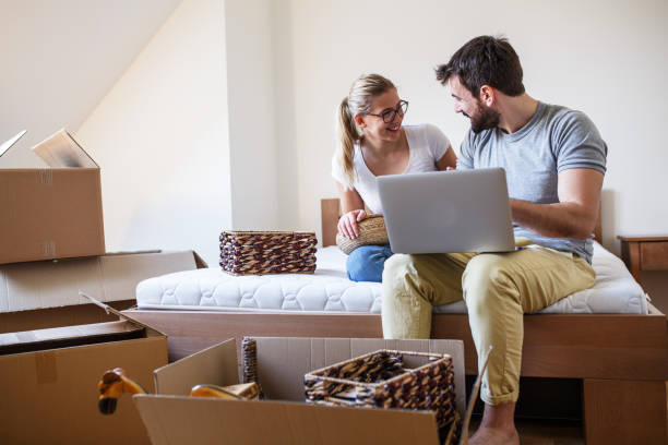 istock Young couple moving into new home. 1274870710