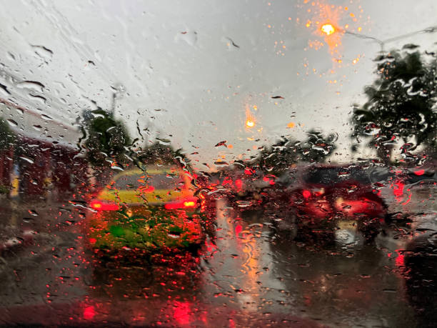 istock Rain on the car window on a rainy day 1274888056