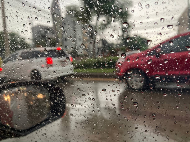 istock Rain on the car window on a rainy day 1274888117