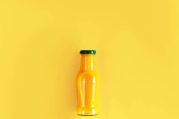 istock Oranges and citruses isolated on yellow background 1274896475