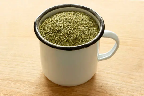 Photo of crushed thyme in zinc cup