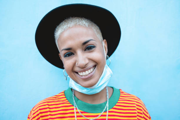 istock Mixed race smiling on camera wearing face protective mask during coronavirus outbreak 1274902734