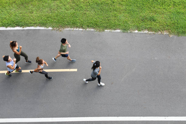 istock Young team jogging on city bridge 1274908631