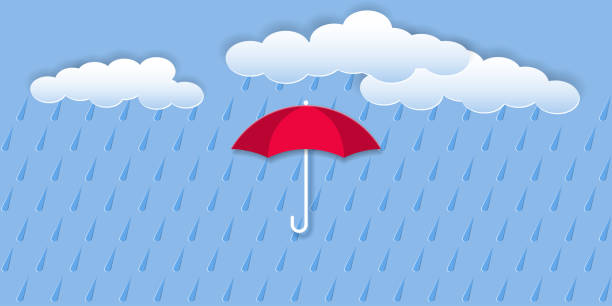 istock Blue background with rain, umbrella and white clouds. Paper cut out style and effect of embossed snowflakes 1274918647