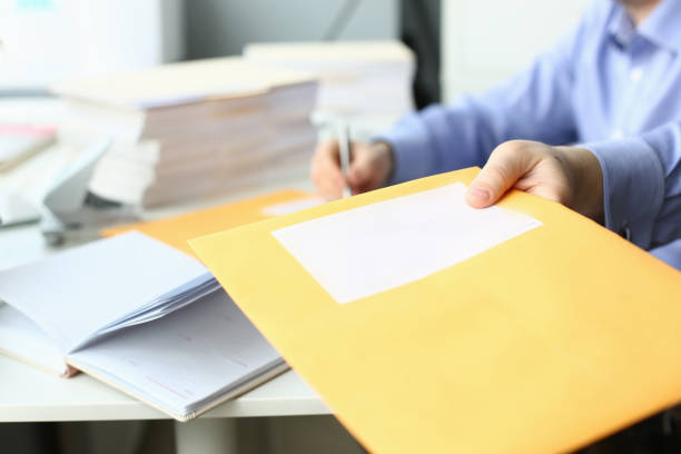 istock Young project manager giving technical card to colleague 1274928965