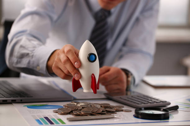 istock Young office worker shaking his piggy bank 1274928988