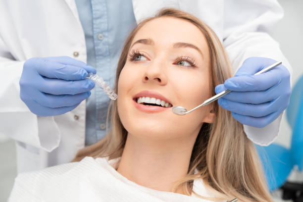 istock Woman having teeth examined at dentists 1274929096