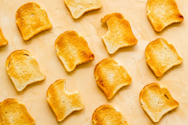 istock Slices of toast bread pattern. Food background. Top view 1274929139