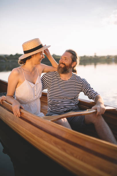 istock Romantic couple relaxing in boat 1274950027
