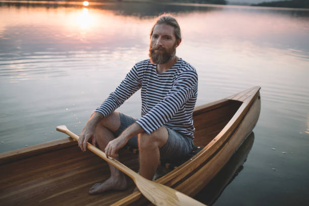 istock Bearded man relaxing in the canoe 1274951414