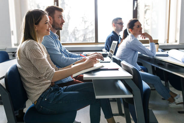 istock University  students listen to  lecture in classroom. 1274958805