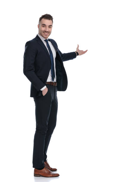 istock Side view of confident businessman smiling and presenting 1274958911