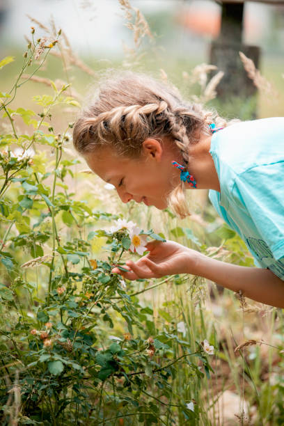 istock A young beautiful girl playing in the forest 1274958998